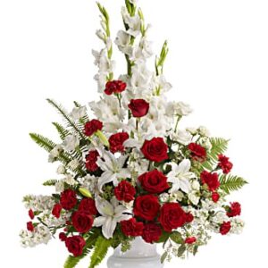 Red roses paired with dainty white flowers